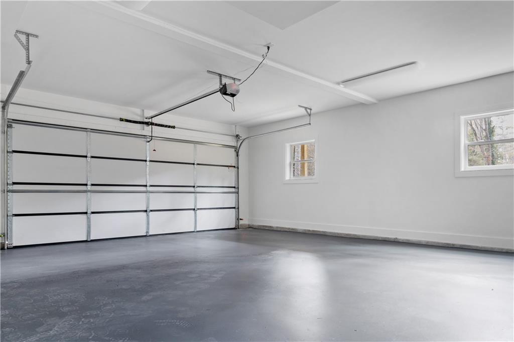 515 Chevelle Lane Decatur, GA 30030 - Photo 36 of 39 an empty room with wooden floor and windows