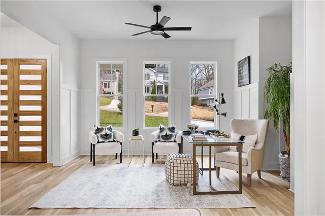 a living room with patio furniture and a window