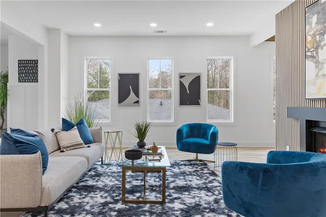 a living room with furniture and a rug