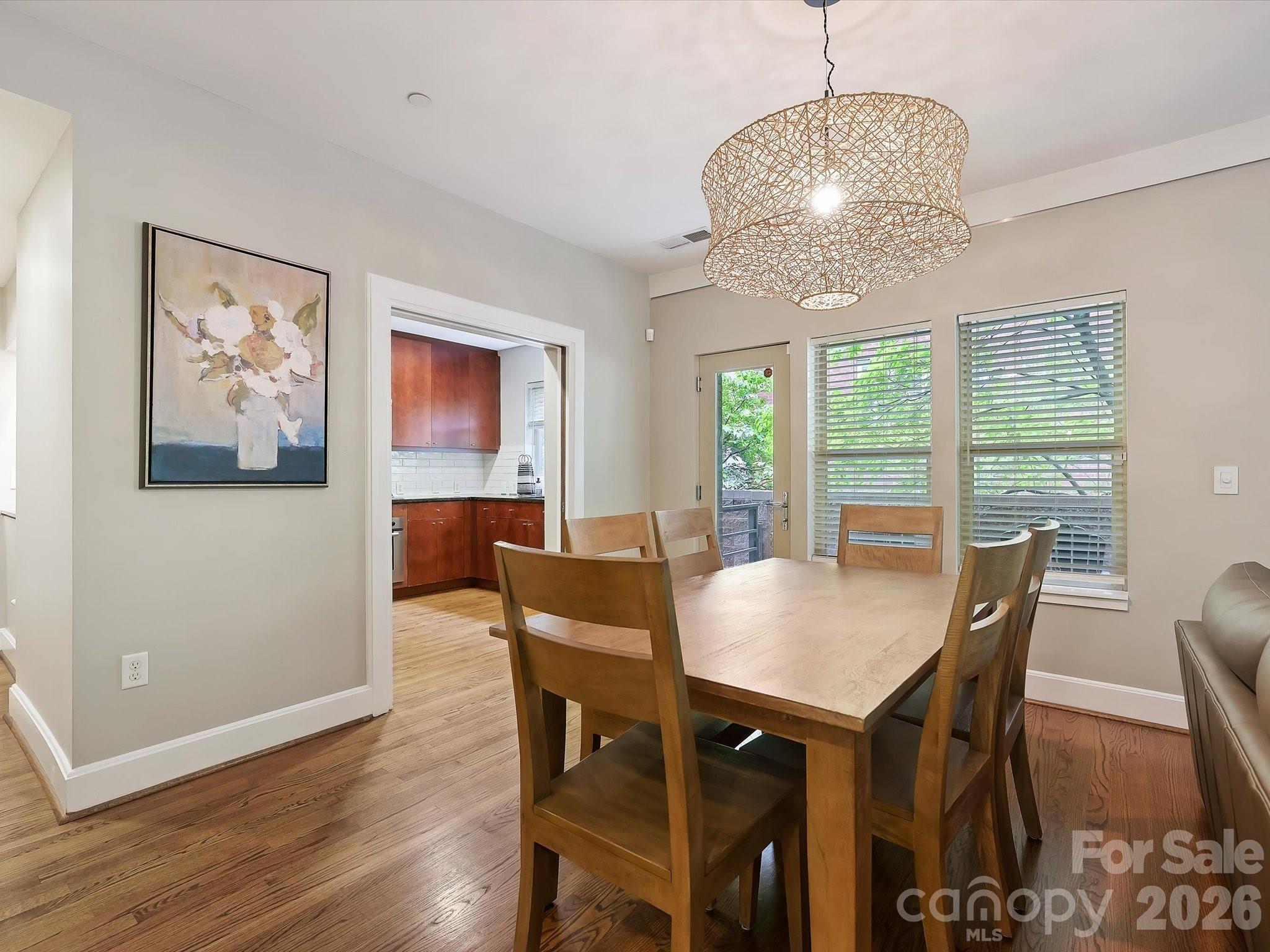 420 Queens Road Charlotte, NC 28207 - Photo 9 of 35 a view of a dining room with furniture window and wooden floor