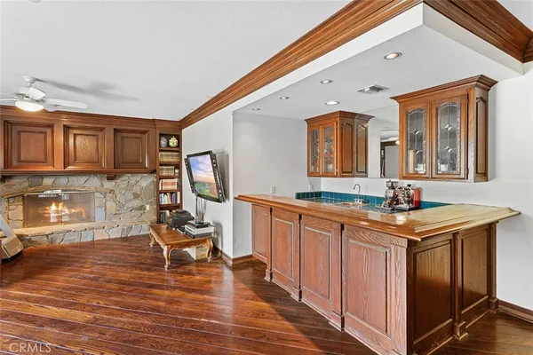 a kitchen with granite countertop a stove and cabinets