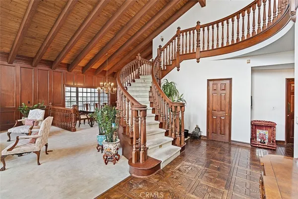 a view of hall way with furniture