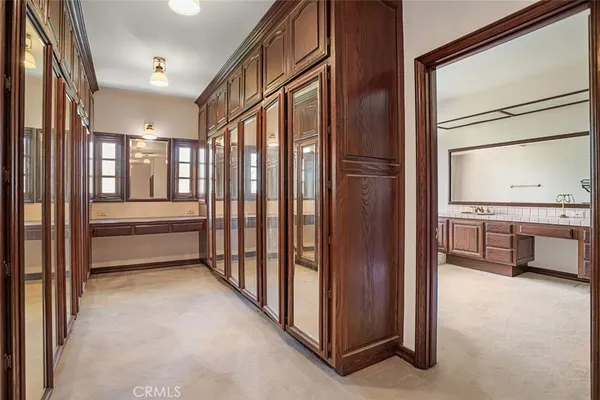 a view of a hallway with kitchen and entryway