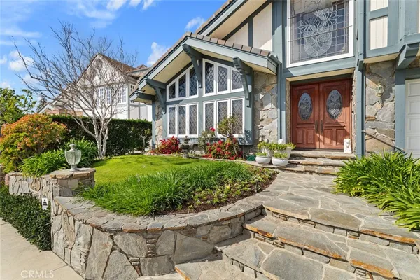 a front view of a house with garden