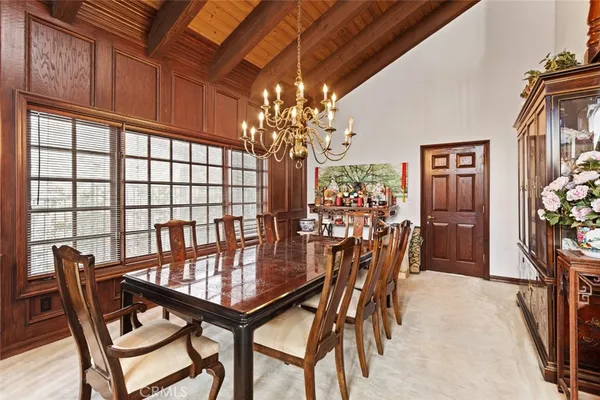 a dining room with furniture and window