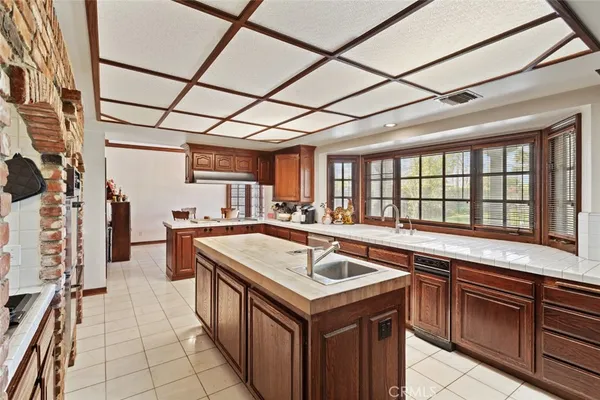 a kitchen that has a sink and a stove