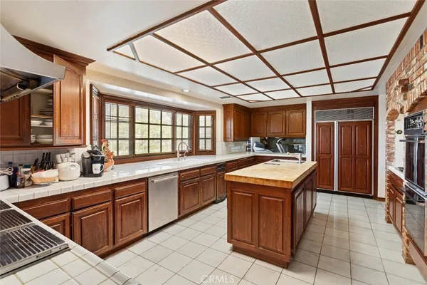 a kitchen with a sink and wooden cabinets