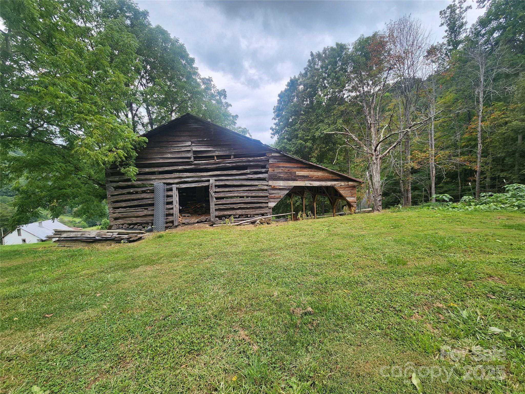 1925 South Fork Road Marshall, NC 28753 - Photo 3 of 42 a view of a house with a yard