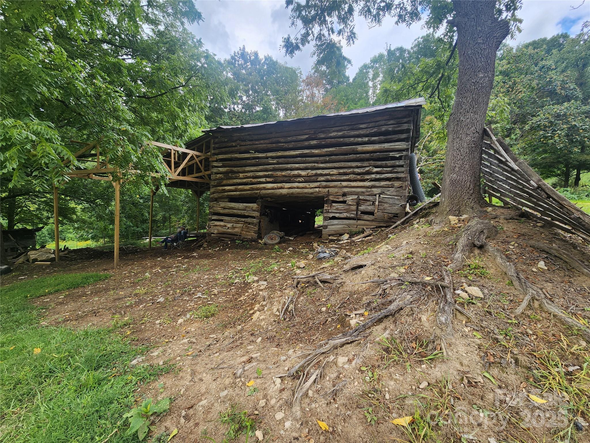 1925 South Fork Road Marshall, NC 28753 - Photo 4 of 42 a view of a wooden bench in a yard