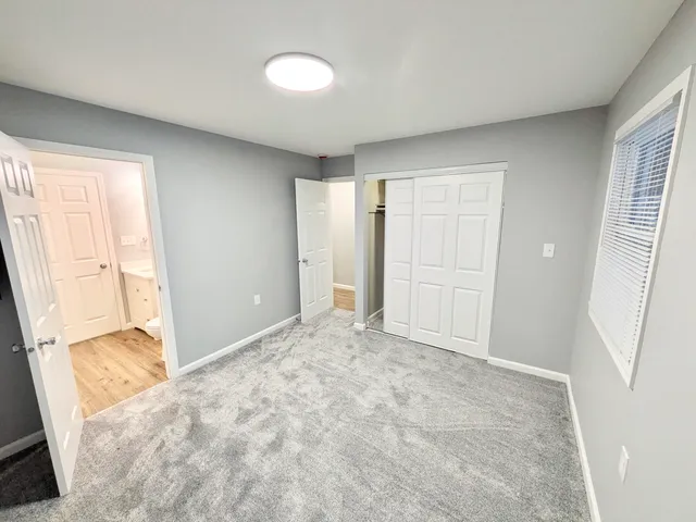 a bathroom with a sink toilet a mirror and shower