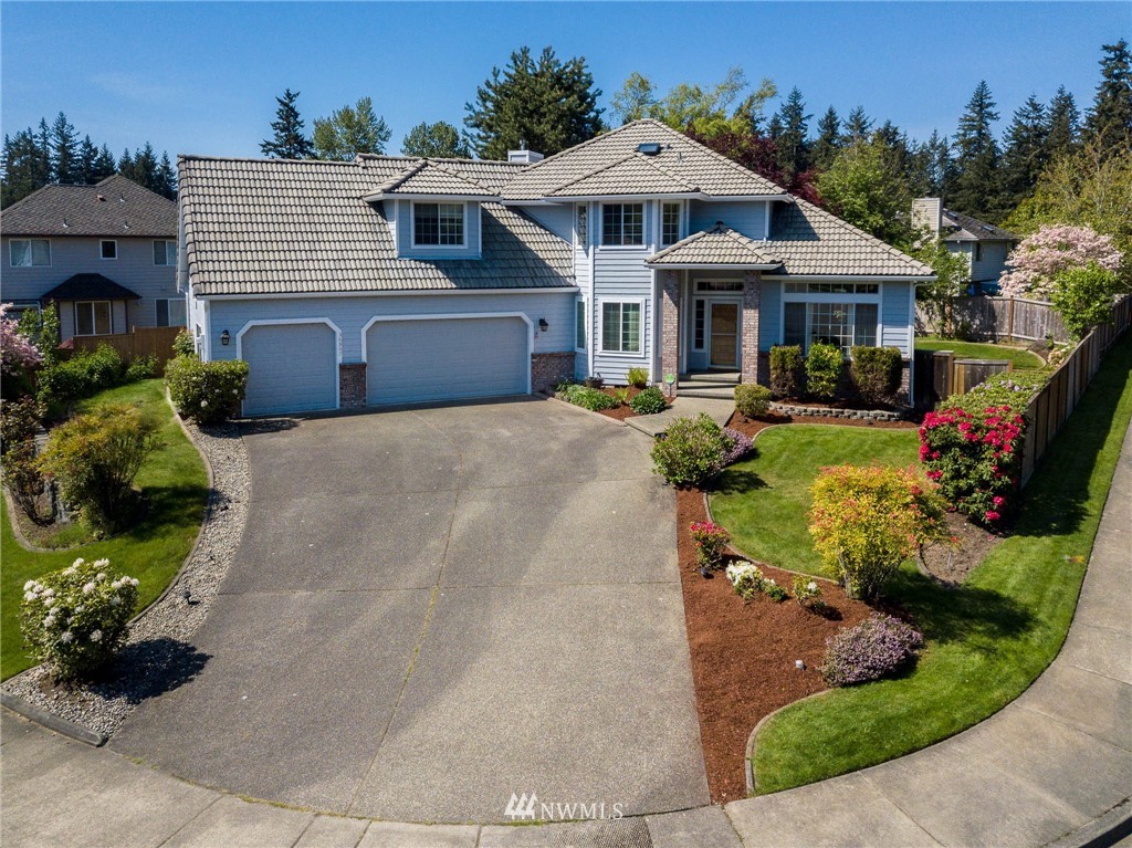 36907 17th Avenue South Federal Way, WA 98003 - Photo 1 of 25 a front view of a house with a yard and potted plants