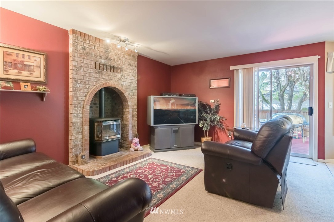 36907 17th Avenue South Federal Way, WA 98003 - Photo 12 of 25 a bedroom with furniture and a fireplace