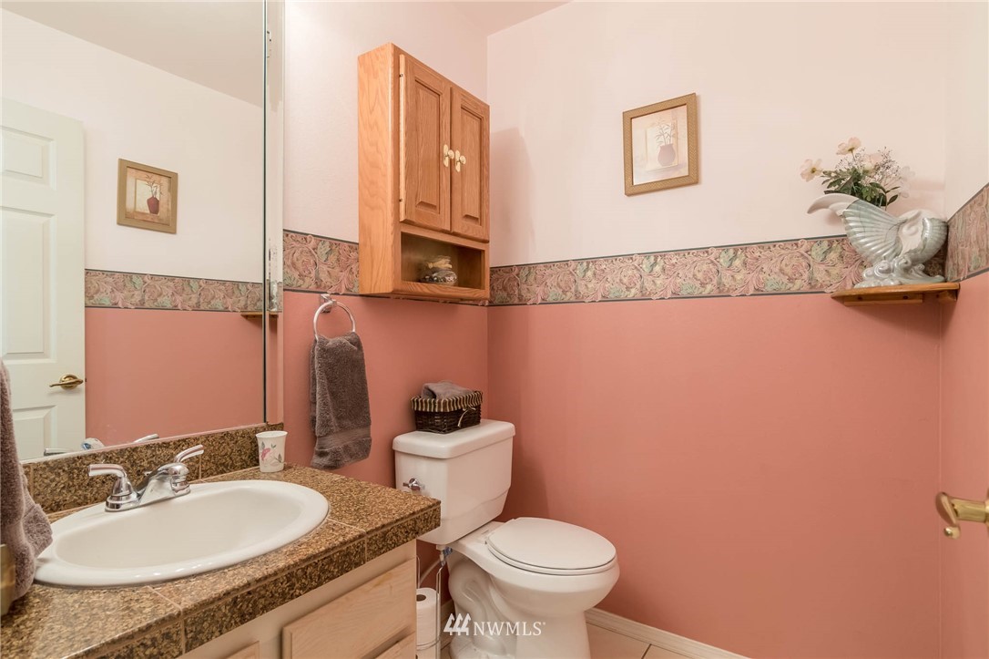 36907 17th Avenue South Federal Way, WA 98003 - Photo 13 of 25 a bathroom with a granite countertop sink and a mirror