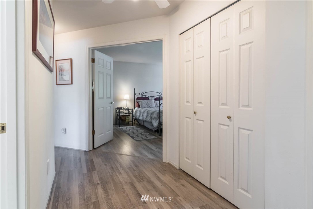36907 17th Avenue South Federal Way, WA 98003 - Photo 16 of 25 a view of a hallway with wooden floor and closet