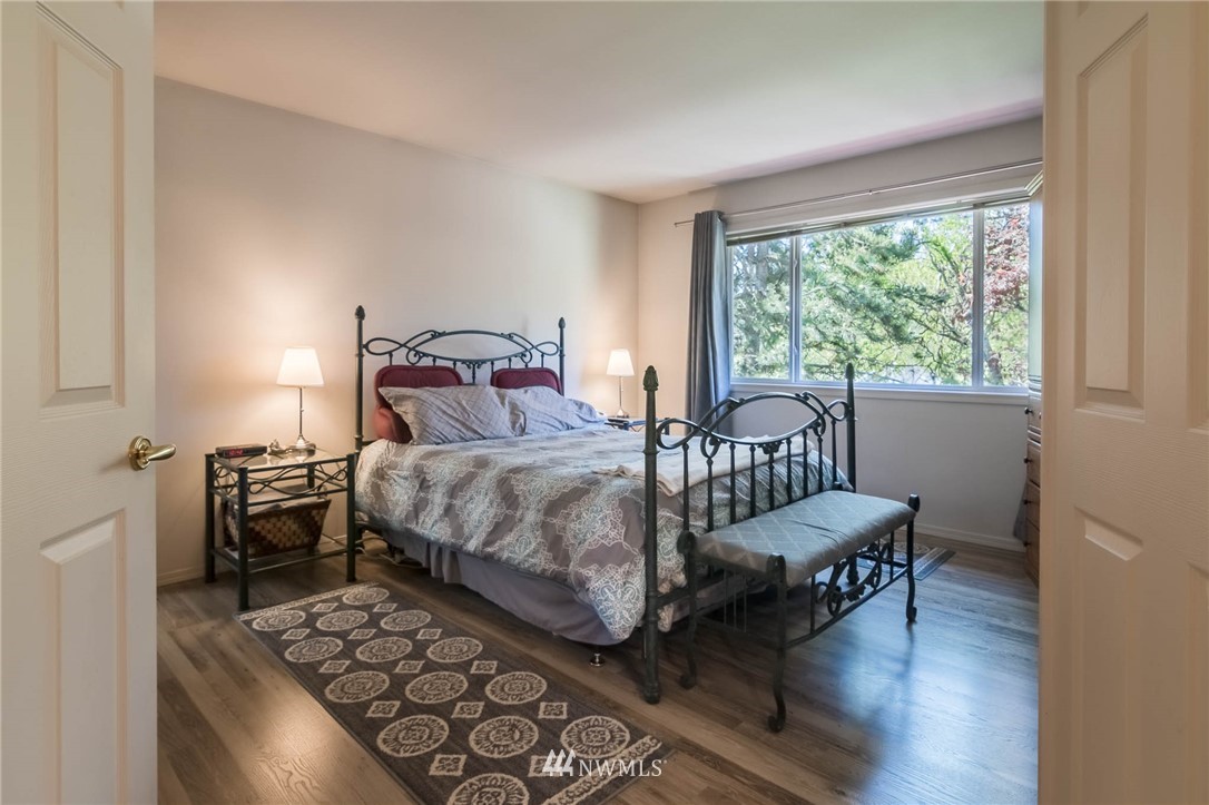 36907 17th Avenue South Federal Way, WA 98003 - Photo 17 of 25 a bedroom with a bed and a table in it