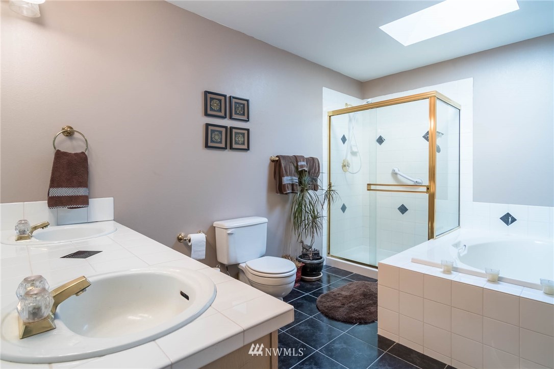36907 17th Avenue South Federal Way, WA 98003 - Photo 18 of 25 a bathroom with a sink and a toilet