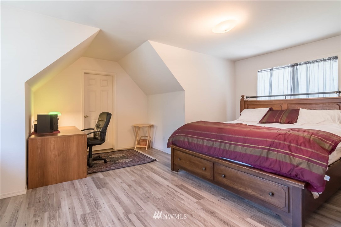 36907 17th Avenue South Federal Way, WA 98003 - Photo 19 of 25 a bedroom with a bed a desk and chair with window