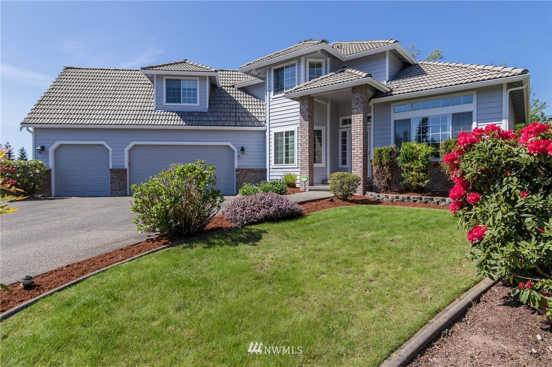 36907 17th Avenue South Federal Way, WA 98003 - Photo 3 of 25 a front view of a house with a yard and porch