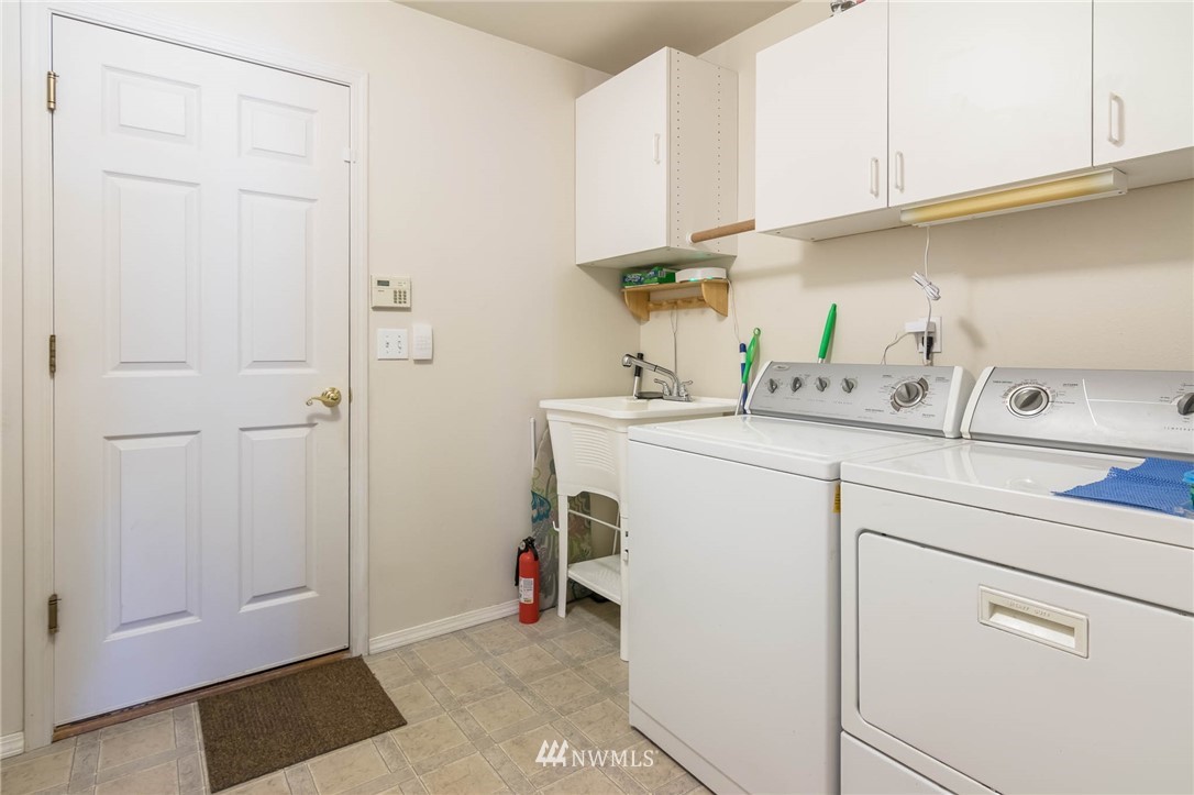 36907 17th Avenue South Federal Way, WA 98003 - Photo 22 of 25 a utility room with sink dryer and washer