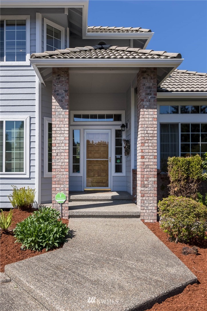 36907 17th Avenue South Federal Way, WA 98003 - Photo 4 of 25 a front view of a house with garden