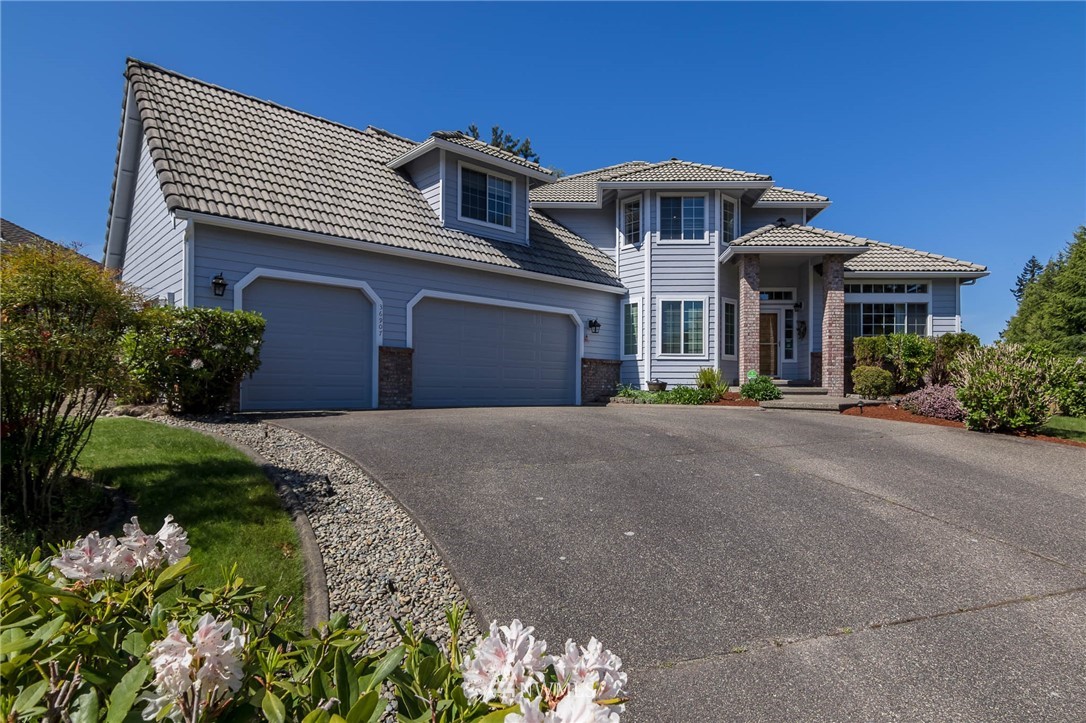 36907 17th Avenue South Federal Way, WA 98003 - Photo 5 of 25 a front view of a house with a garden