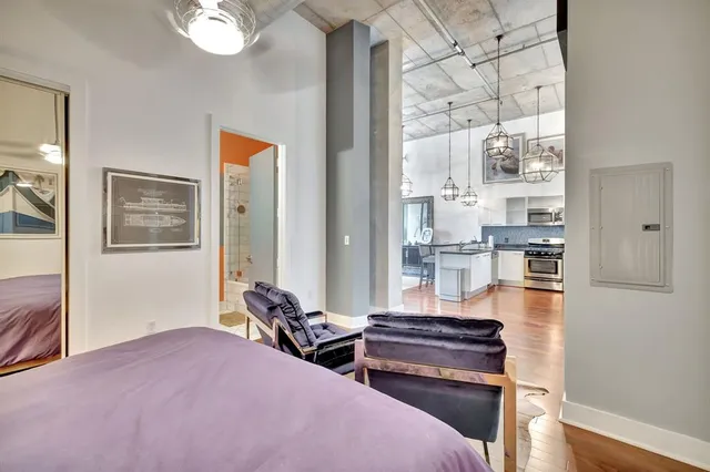 a bedroom with bed and a window