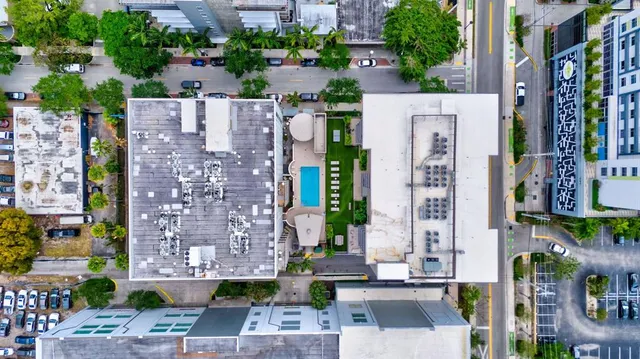 a swimming pool view with a outdoor seating