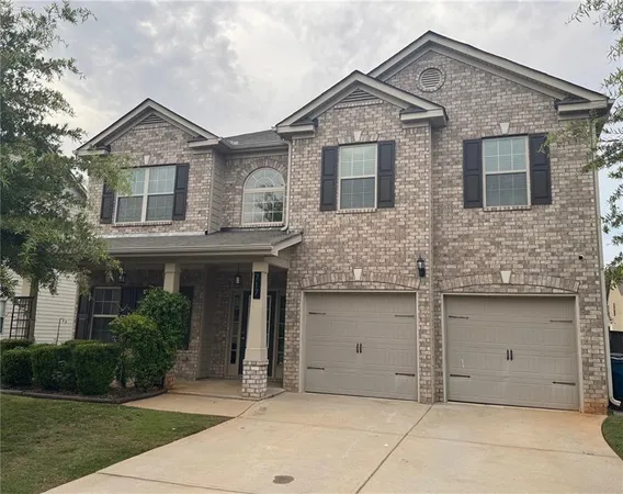 a front view of a house with garage