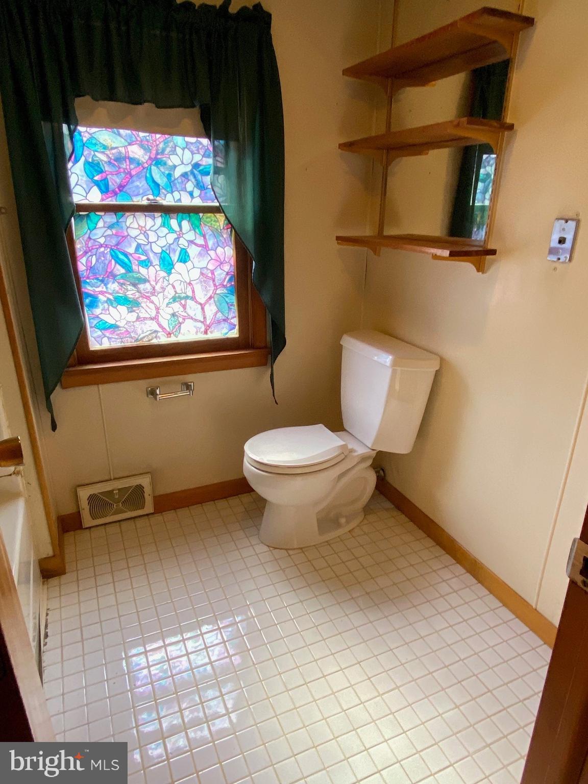 74 South Broadway Pennsville, NJ 08070 - Photo 13 of 22 a bathroom with a toilet and a shower
