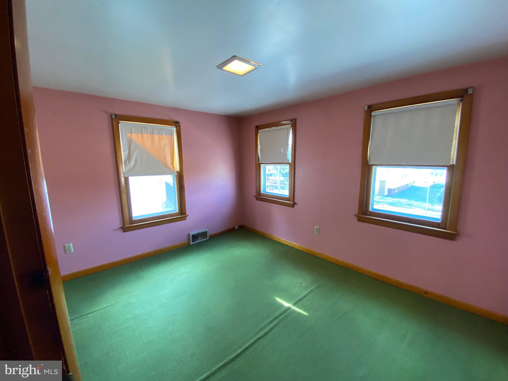 74 South Broadway Pennsville, NJ 08070 - Photo 19 of 22 a view of an empty room with window and stairs