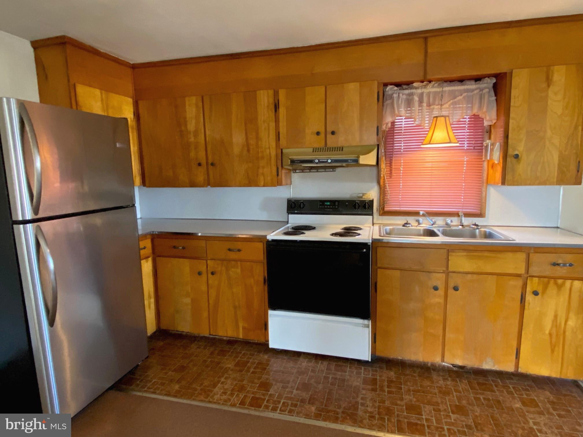 74 South Broadway Pennsville, NJ 08070 - Photo 6 of 22 a kitchen with stainless steel appliances granite countertop a refrigerator a stove a sink and a microwave