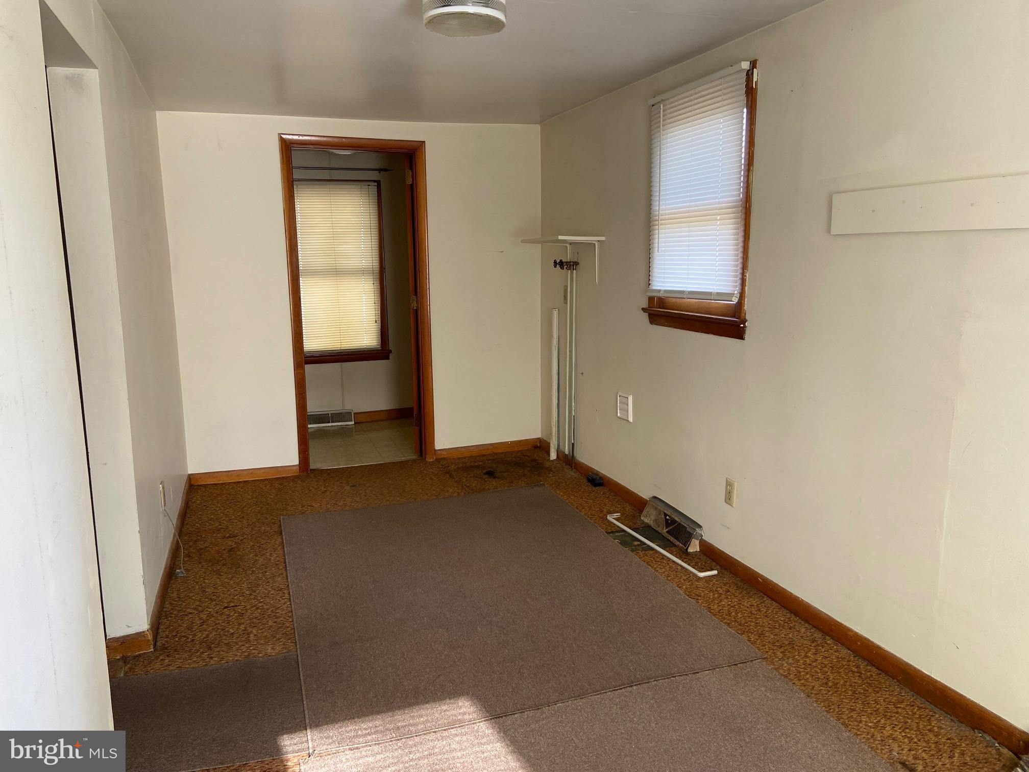 74 South Broadway Pennsville, NJ 08070 - Photo 9 of 22 an empty room with windows