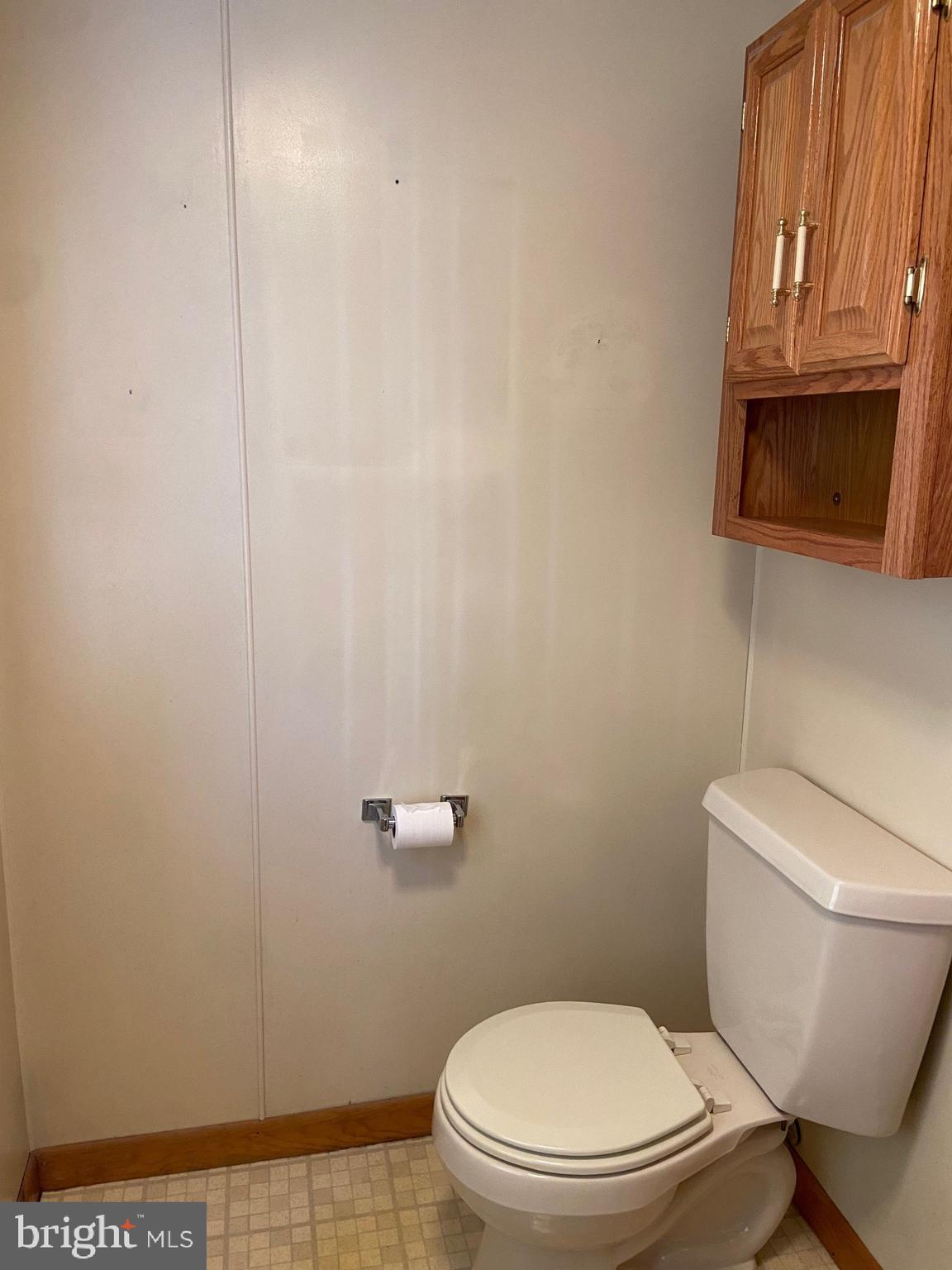 74 South Broadway Pennsville, NJ 08070 - Photo 10 of 22 a white toilet sitting next to a shower