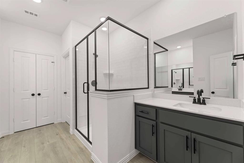 631 Blue Rdg Drive Mansfield, TX 76063 - Photo 21 of 30 a bathroom with a double vanity sink and mirror