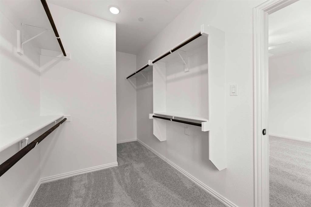 631 Blue Rdg Drive Mansfield, TX 76063 - Photo 25 of 30 a view of walk in closet with empty racks