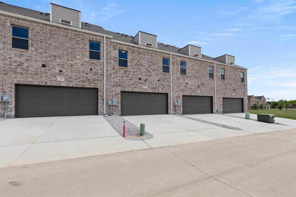 631 Blue Rdg Drive Mansfield, TX 76063 - Photo 29 of 30 a front view of a house with yard and parking