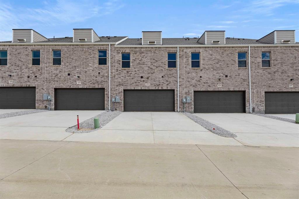 631 Blue Rdg Drive Mansfield, TX 76063 - Photo 30 of 30 a front view of a building with parking space and garage