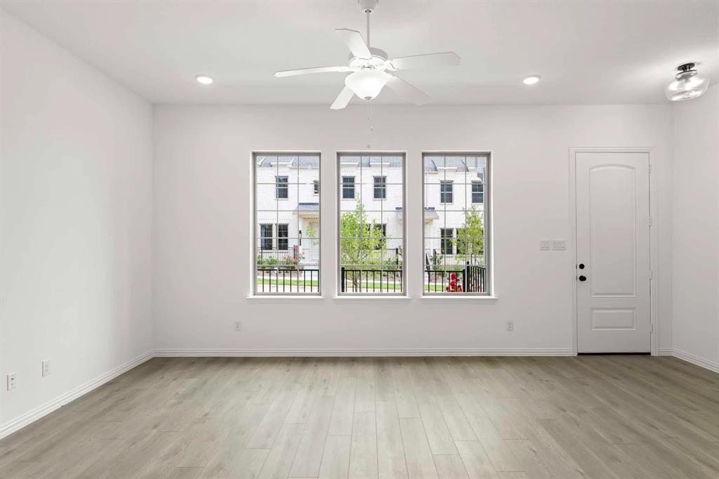 631 Blue Rdg Drive Mansfield, TX 76063 - Photo 7 of 30 an empty room with wooden floor and windows