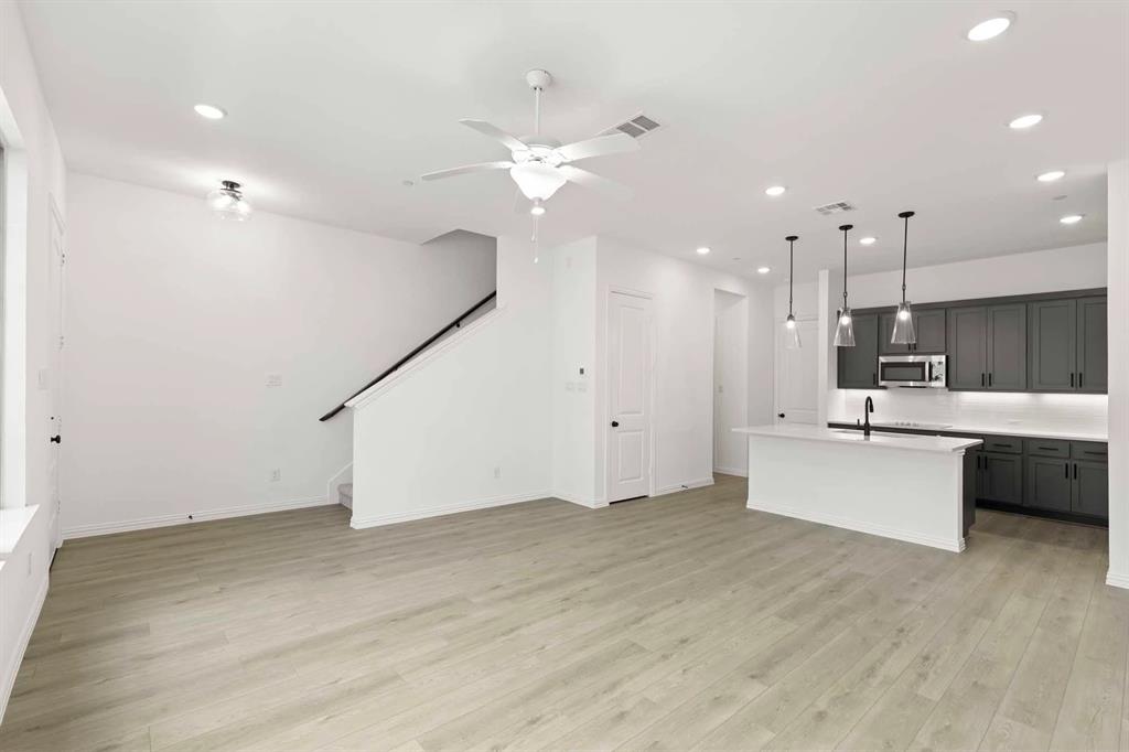 631 Blue Rdg Drive Mansfield, TX 76063 - Photo 9 of 30 a large white kitchen with a large window stainless steel appliances