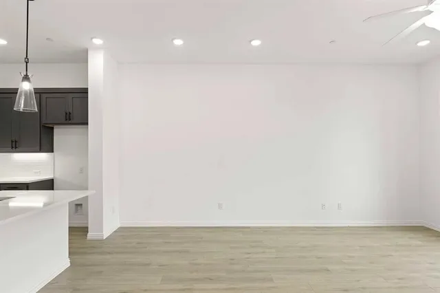 a view of a kitchen with a sink and a stove top oven