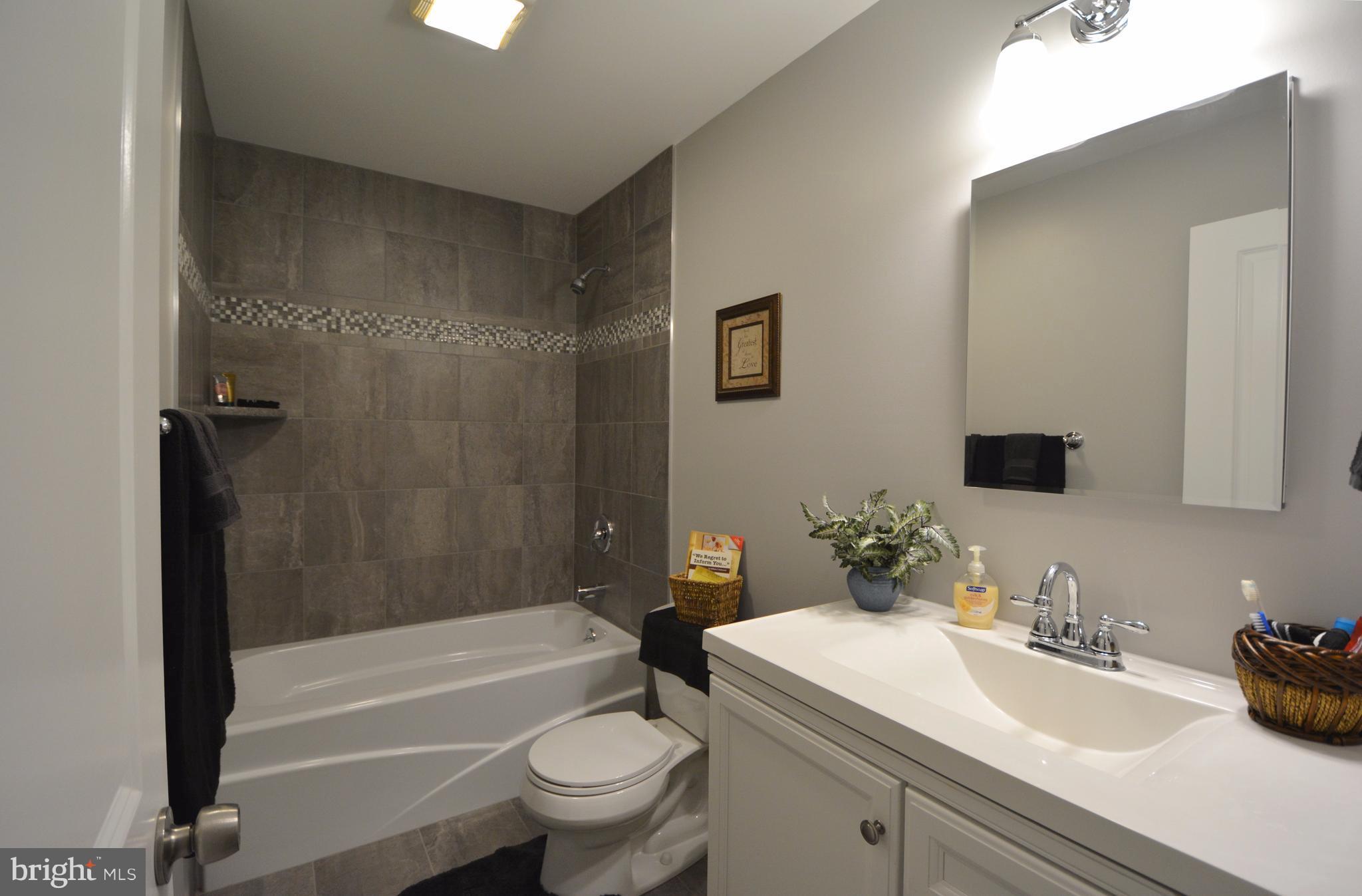 5229 Braddock Road Woodbine, MD 21797 - Photo 15 of 30 Quality, soaker tub tile surround, 3 ft. vanity