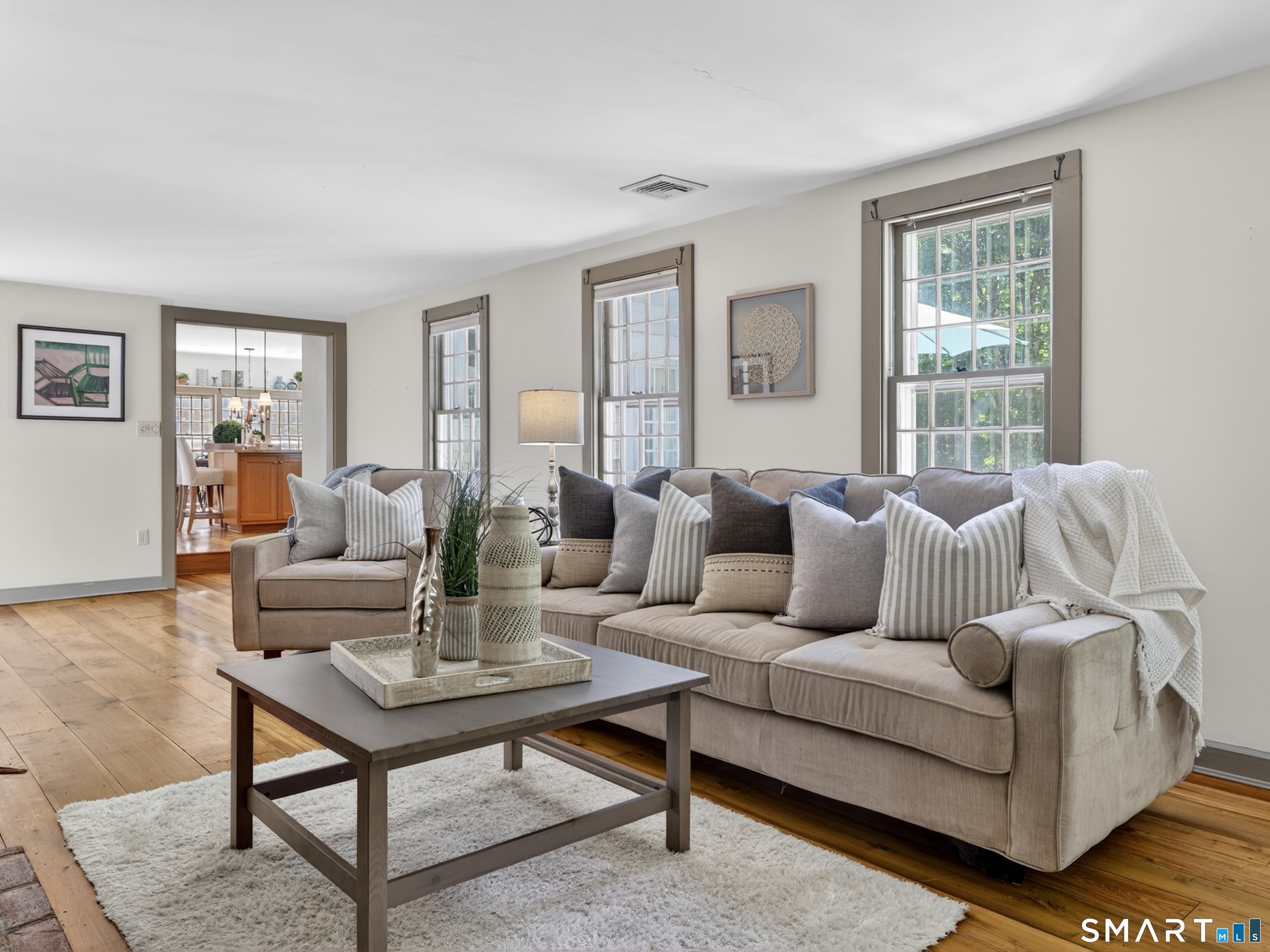 14 Cow Pen Hill Road Killingworth, CT 06419 - Photo 15 of 40 Designed with connection in mind, the family room opens effortlessly to the dining room and kitchen, making gathering with family and friends easy.