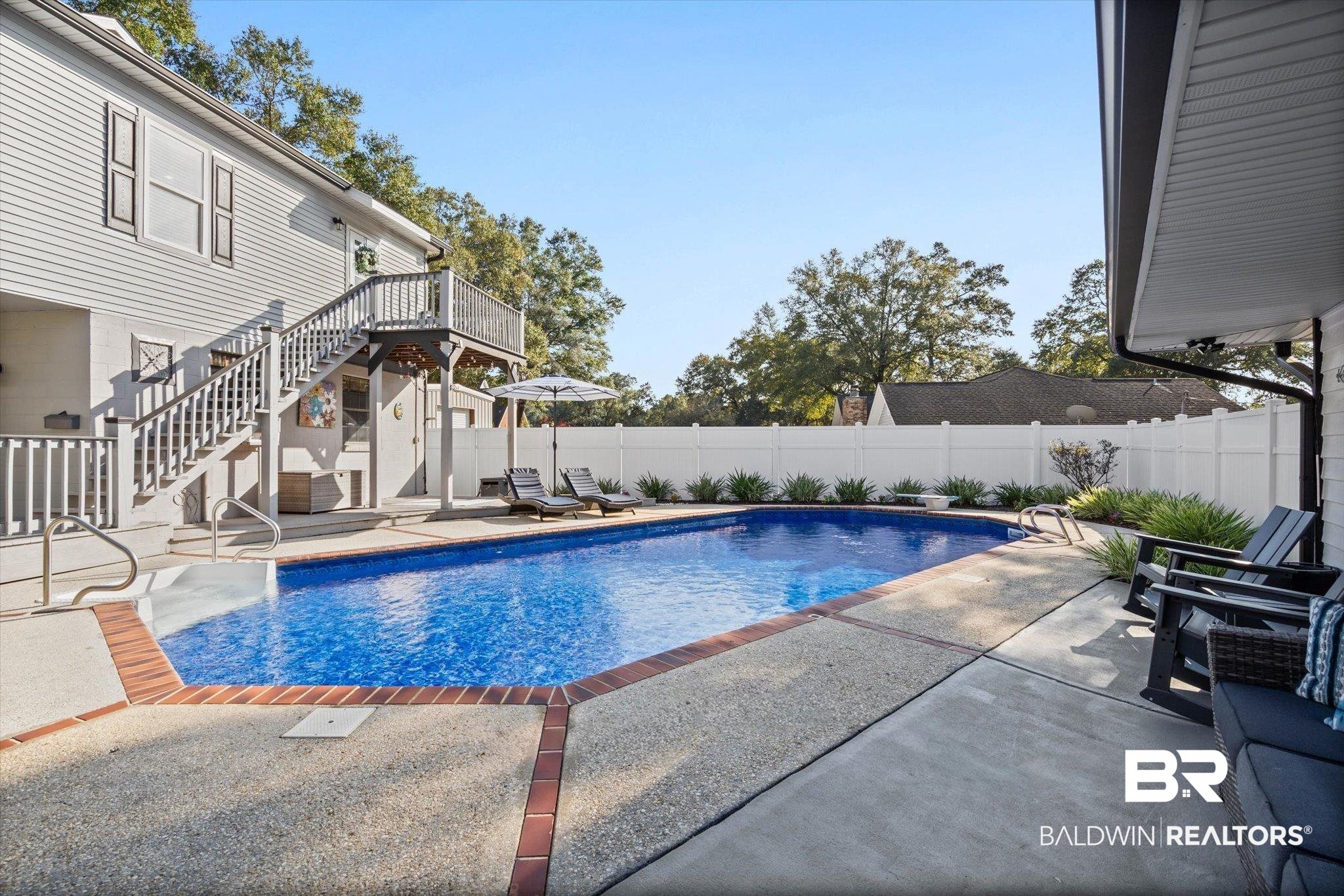 4567 Pine Avenue Saraland, AL 36571 - Photo 41 of 48 View of swimming pool with a patio area, a fenced backyard, stairway, and a wooden deck