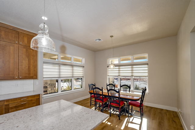 1283 North Gallen Road Santa Clara, UT 84765 - Photo 20 of 103 Dining room featuring wood finished floors and healthy amount of natural light