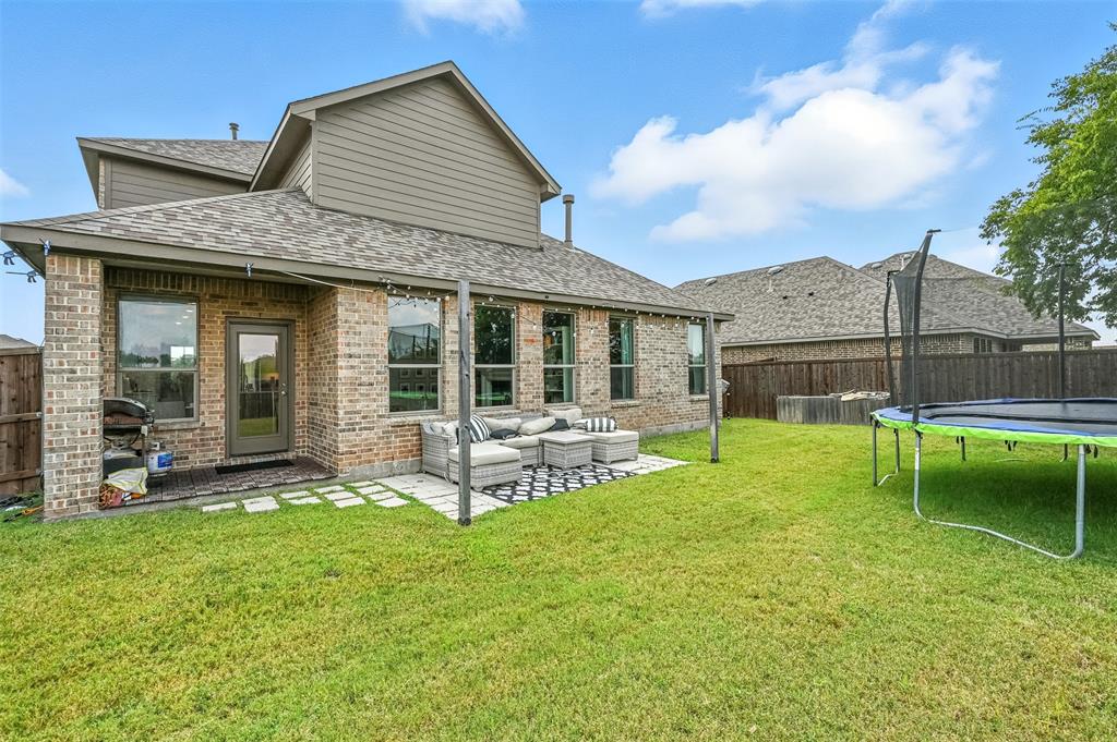 1160 Red Hawk Lane Forney, TX 75126 - Photo 17 of 26 a view of a house with a yard and sitting area