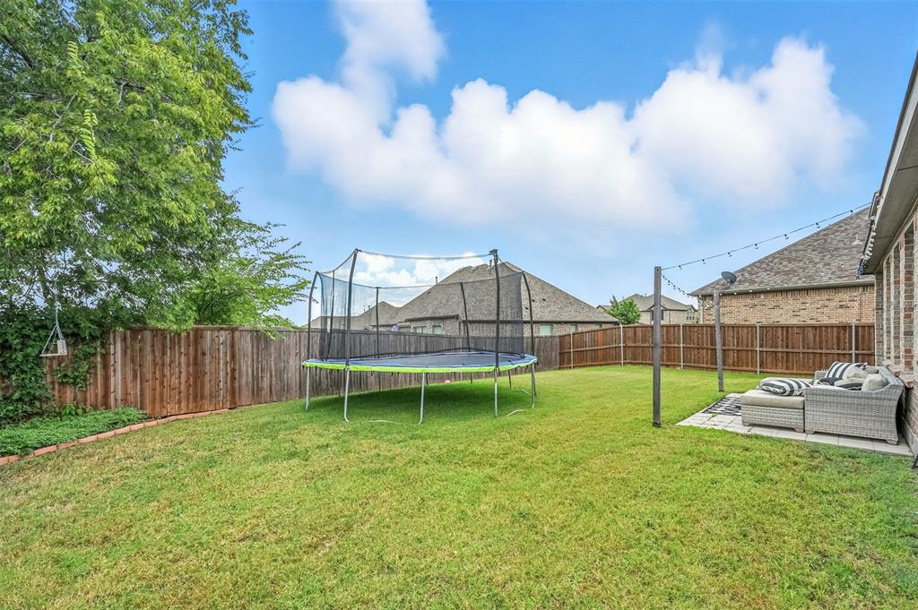 1160 Red Hawk Lane Forney, TX 75126 - Photo 18 of 26 a view of house with backyard