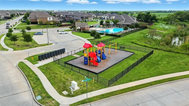 an aerial view of a chairs and table