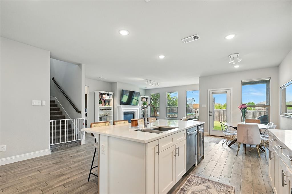 1160 Red Hawk Lane Forney, TX 75126 - Photo 7 of 26 a large white kitchen with sink and cabinets