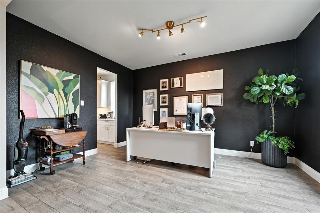 1160 Red Hawk Lane Forney, TX 75126 - Photo 8 of 26 a living room with furniture and potted plants