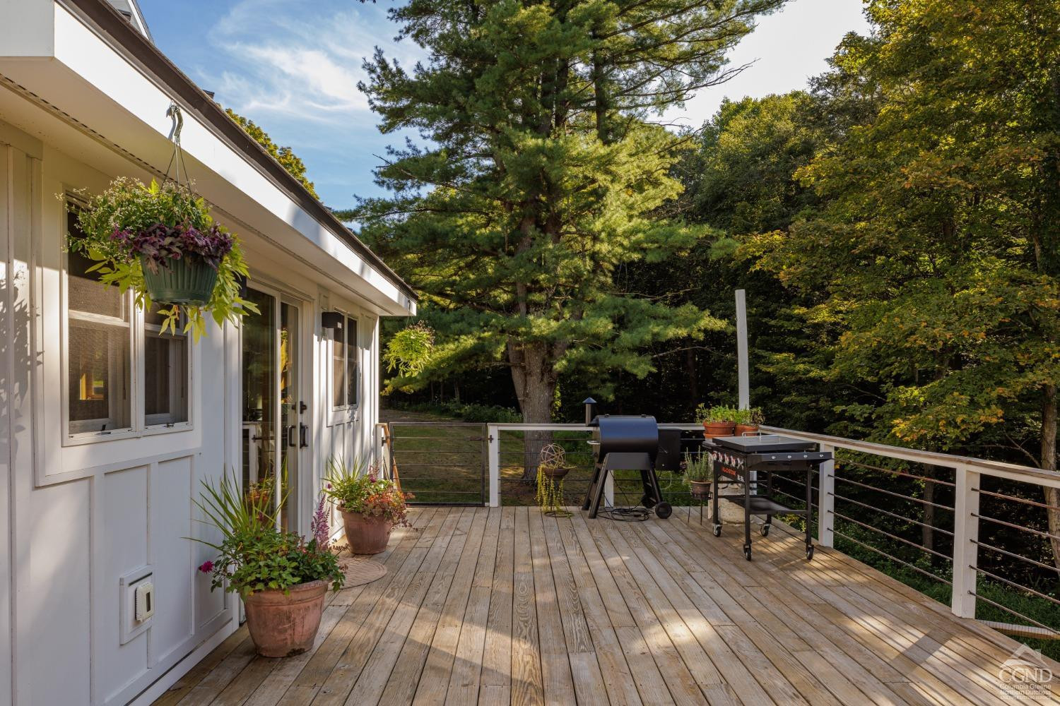 613 Fischer Road Kinderhook, NY 12106 - Photo 17 of 21 a view of house with deck outdoor seating and green space
